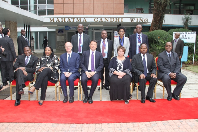 H.E Matteo Renzi Prime Minister of Italy (seated 4th left) , CS Amina Abdalla (2nd left) and  University management pause outside Taifa Hall 2015