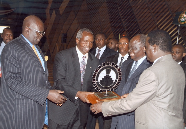Mr. John Simba, Chairman of Council receive the award for the top in the State Corporations category from President Mwai Kibaki & Prime Minister, Raila Odinga during the performance contract awards 2011