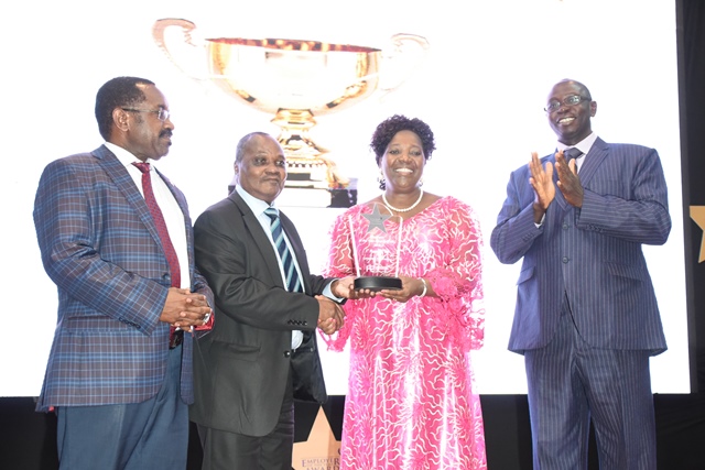 University Officials accept trophy for 1st runners up, Corporate Perfomance category during Employer of the Year Awards Gala Dinner 2018