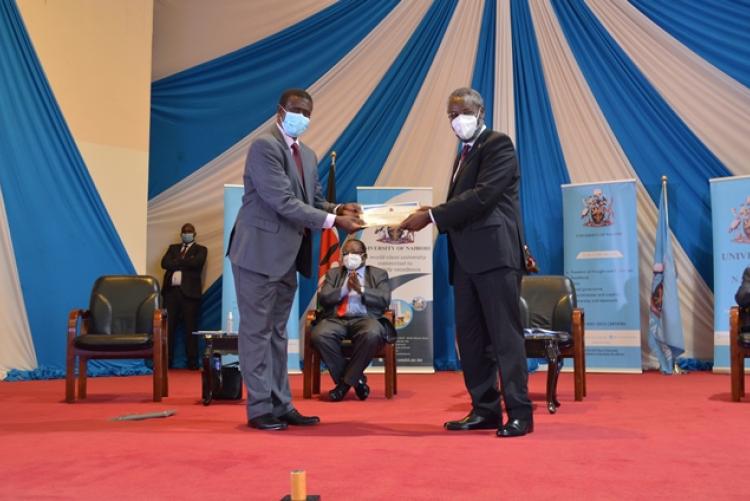 UoN staff picking an award at the PC awards Ceremony 
