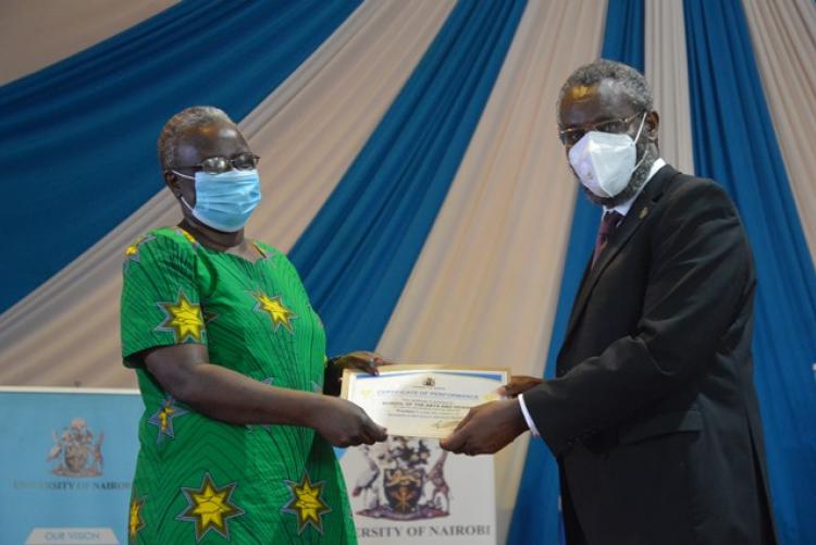 VC Prof, Kiama hands over an award at the PC awards Ceremony 