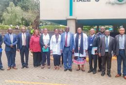 Deputy Vice-Chancellor for Finance, Planning and Development, Prof. Josiah Aduda, poses for a group photo with University Health Services staff during his familiarization tour of the facility.