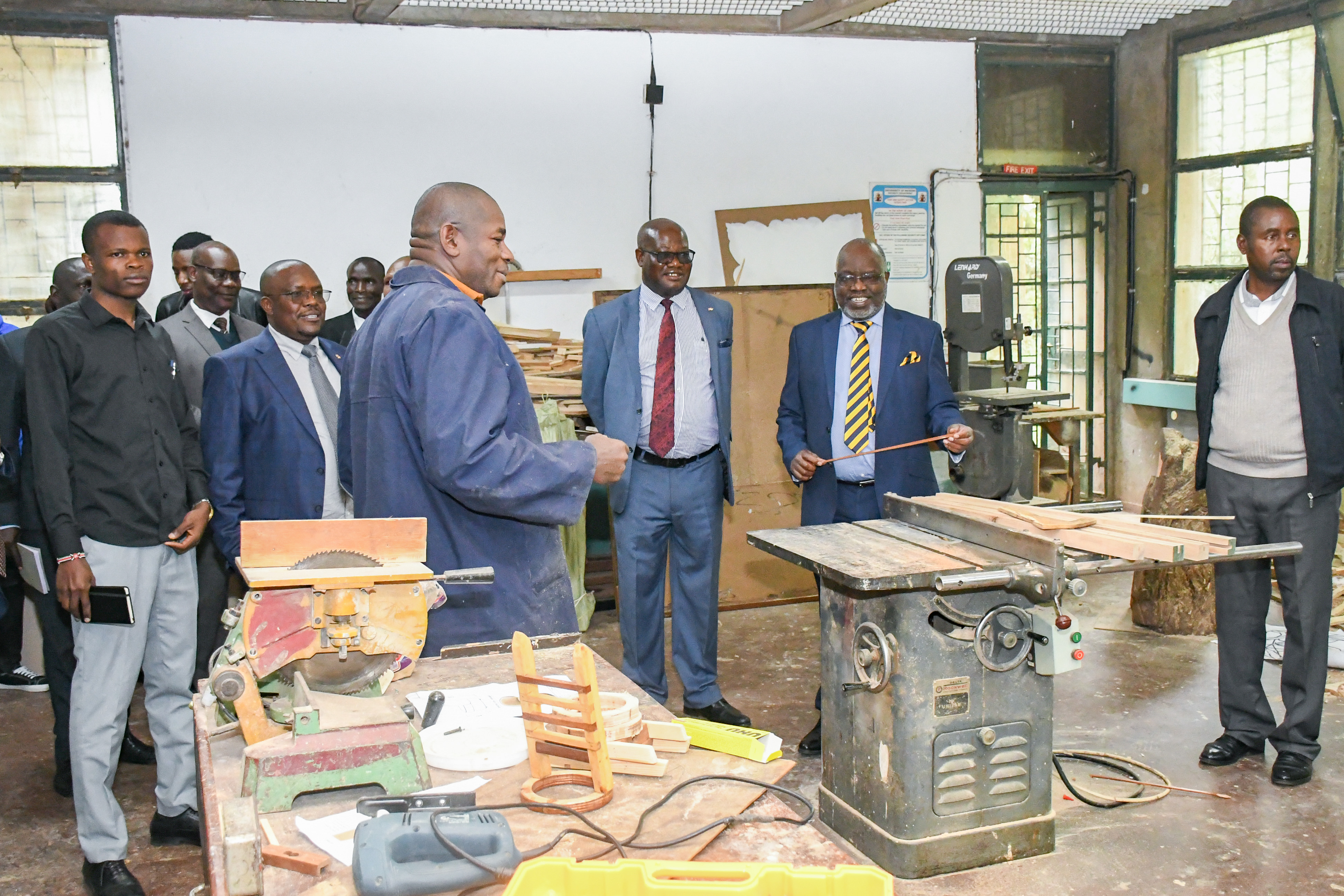 DVC Prof. Josiah Aduda (centre), accompanied by the Dean of the Faculty of Built Environment and Design, Prof. Kakumu, and Chairs of Departments, inspects the faculty's teaching and learning facilities during his familiarization tour.