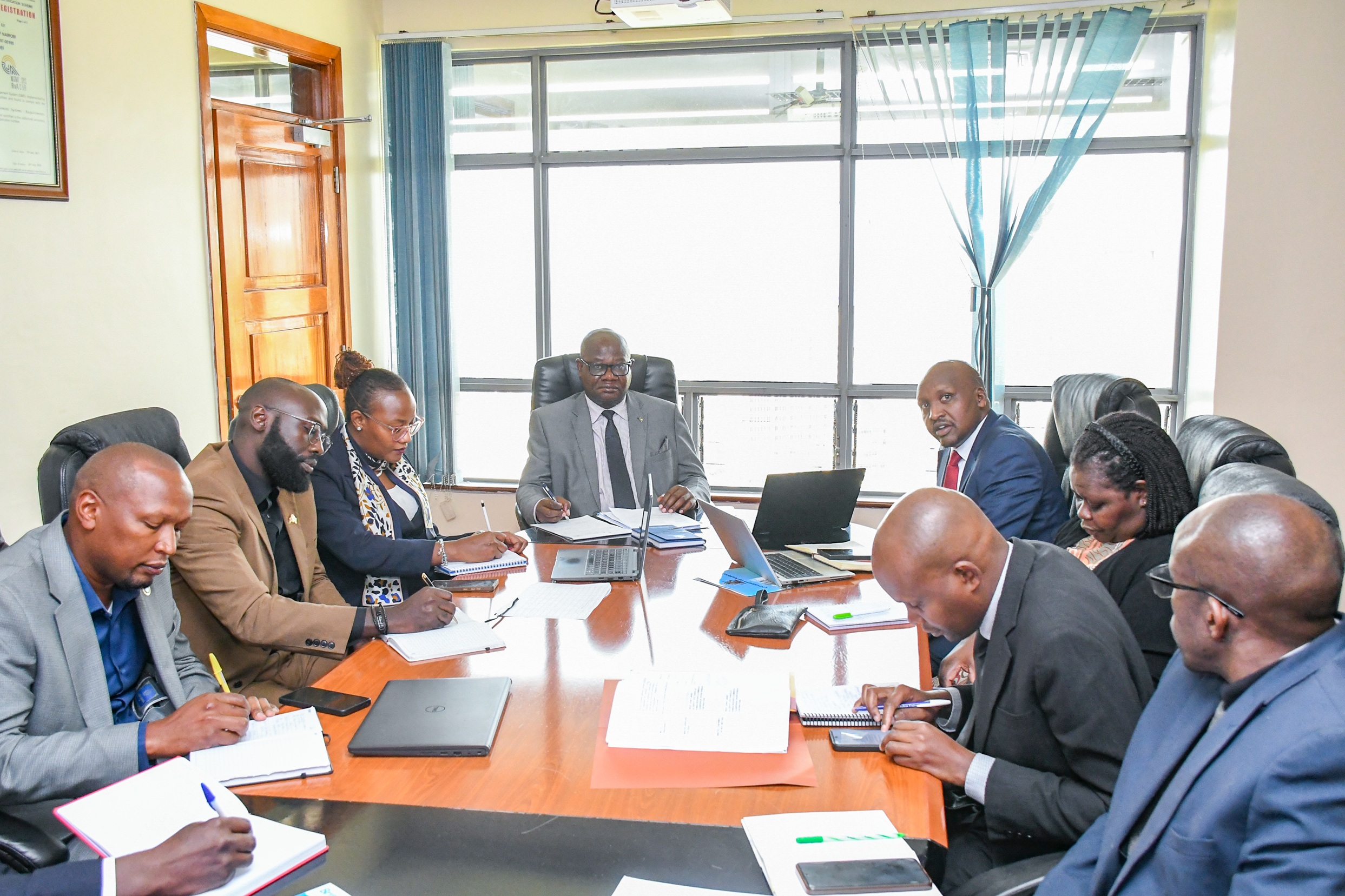 The DVC Finance, Planning and Development, Prof Josiah Aduda with University of Nairobi senior staff and Britam Holding delegation.