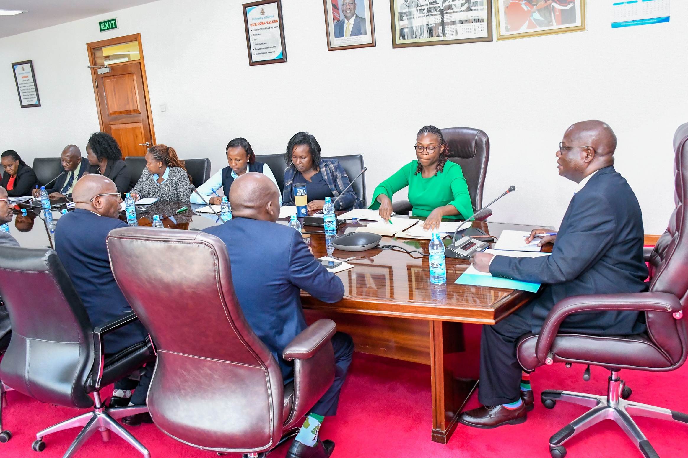 The DVC FPD Prof Josiah Aduda listens to the OAG team
