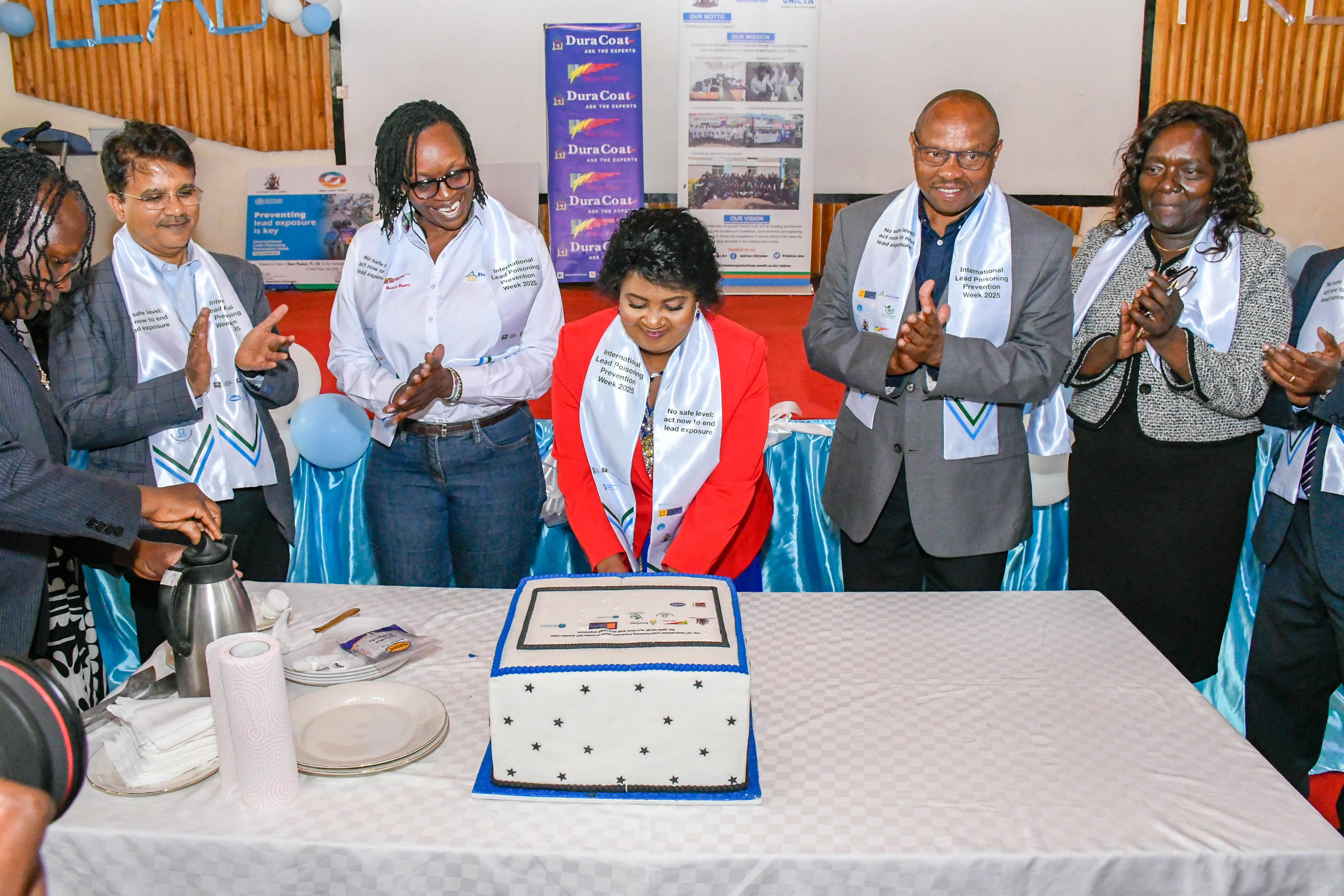 Cutting of the reaffirmation cake at 13th Lead Poisoning Conference
