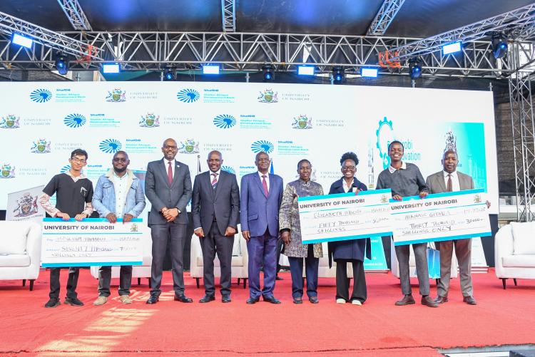 The winning innovation teams display their awards during a group photo with University leaders and the Chief Executive Officer of the Kenya National Innovation Agency (KeNIA), Dr. Tonny Omwansa, following the successful conclusion of Nairobi Innovation Week 2026.