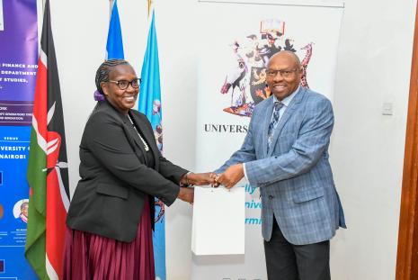 DVC-FPD Prof Jackson Maalu Gifts the PS for Trade Ms Regina Ombam