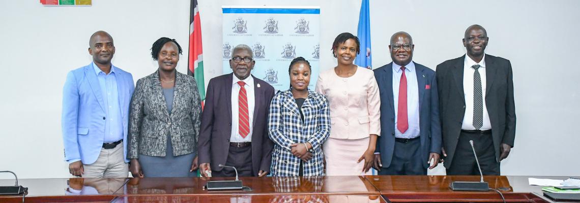 Senior University staff, led by Chair of Council, Prof Chacha Nyaigotti Chacha, pose for a group photo with officials from the Ministry of Education after the successful conclusion of the 2026/2027 Performance Contract negotiations.