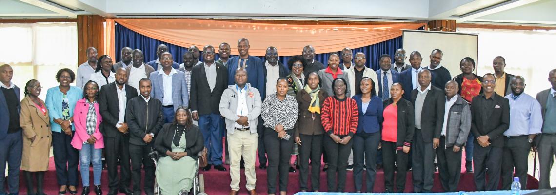 Deputy Vice-Chancellor for Finance, Planning and Development, Prof. Josiah Aduda, poses for a group photo with representatives of the University's Income Generating Units (IGUs) after the financial sustainability workshop