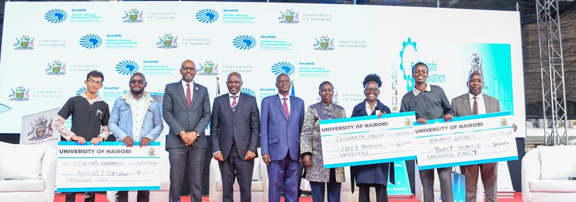 The winning innovation teams display their awards during a group photo with University leaders and the Chief Executive Officer of the Kenya National Innovation Agency (KeNIA), Dr. Tonny Omwansa, following the successful conclusion of Nairobi Innovation Week 2026.