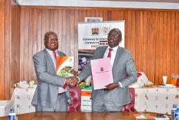The DVC, Prof Josiah Aduda and Kenya Utalii College Principal/CEO Mr. Mark Ogendi exchange the signed MoU following the official signing ceremony.